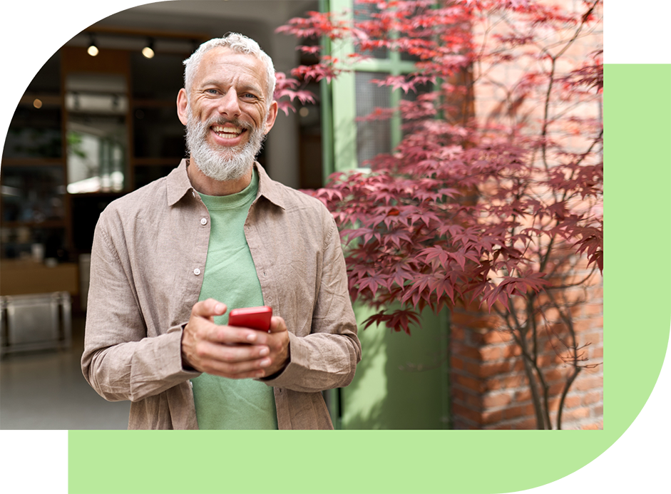 Man-Smartphone-Tea-Green-AdobeStock_528117170