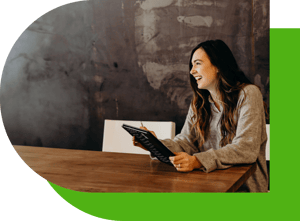 woman-tablet-wooden-table-connect-green-1000px